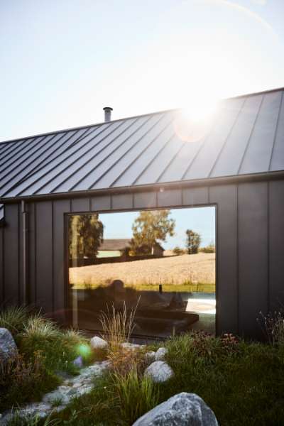 “Royal” door, found in Christiania, now installed in a steel façade, Volstrupvej 63, 9240 Nibe